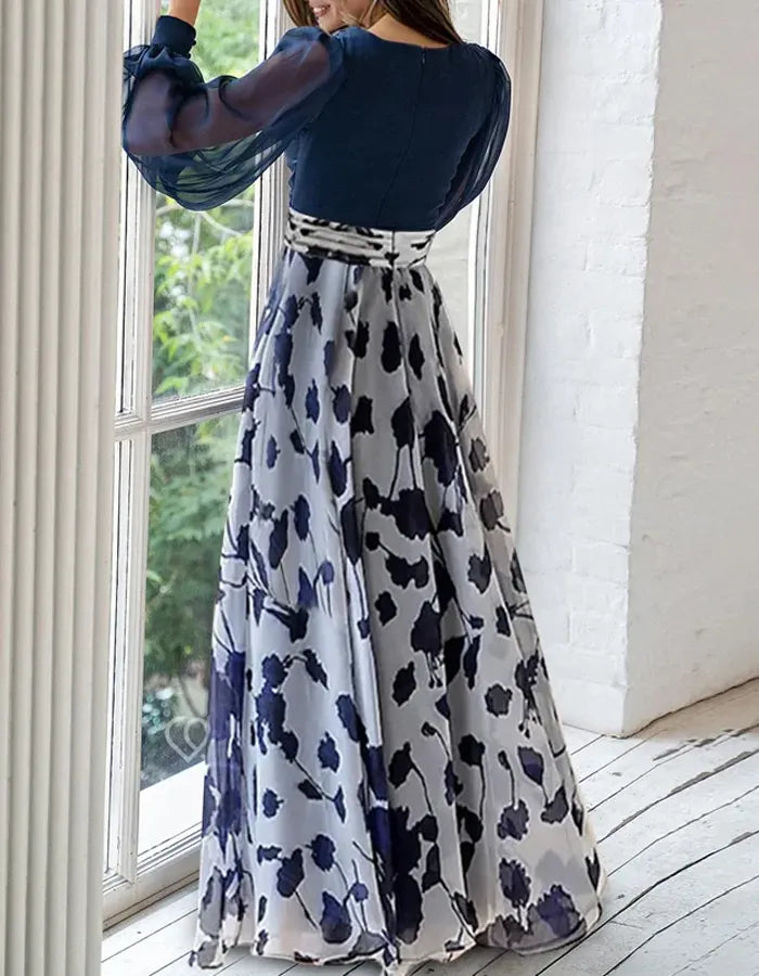 Elegante vestido de noche de gasa azul marino con falda estampada floral y mangas obispo transparentes