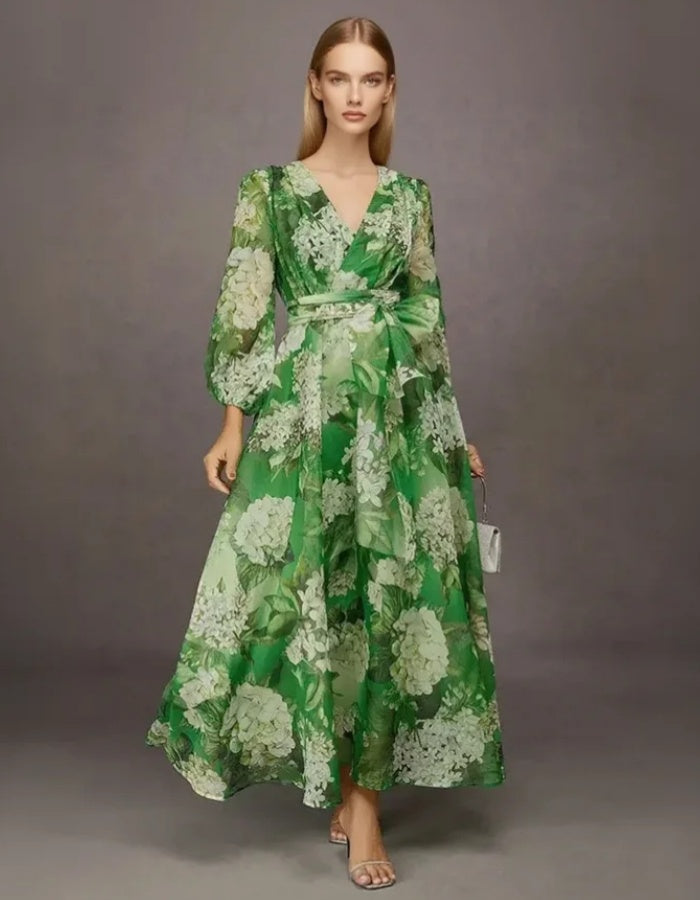 Tief ausgeschnittenes grünes Midikleid mit Blumenmuster und langen Ärmeln