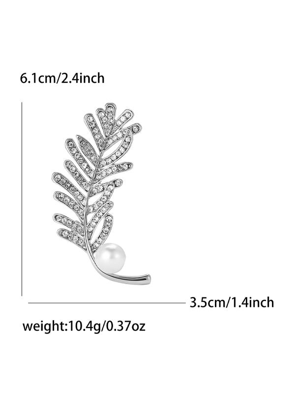 Broche van legering met strass en veer