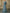 Blaugraues Maxikleid mit drapiertem Stoff und gedrehter Schulter  