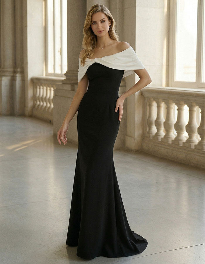 Vestido largo con cola de pez y escote off shoulder en bloques de color negro y blanco