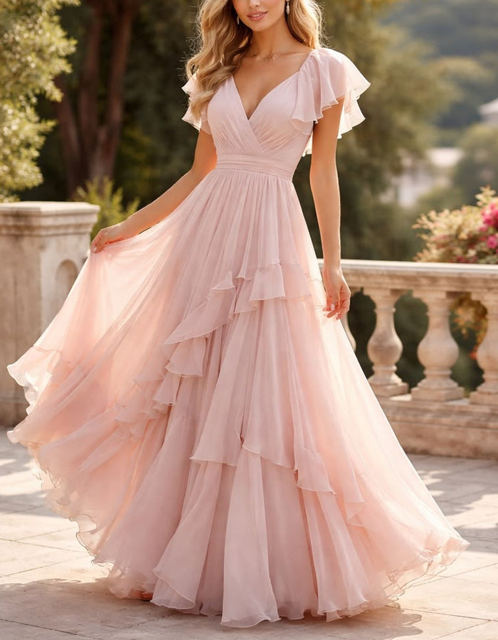 Abito lungo in chiffon rosa con scollo a V, maniche con volant e strati