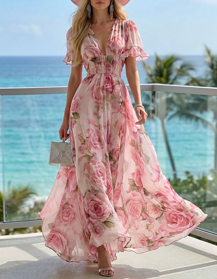 Abito lungo in chiffon rosa con stampa di rose e scollo a V