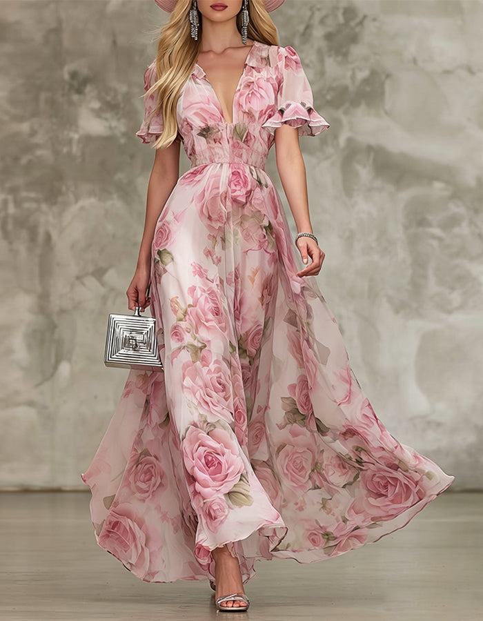 Abito lungo in chiffon rosa con stampa di rose e scollo a V