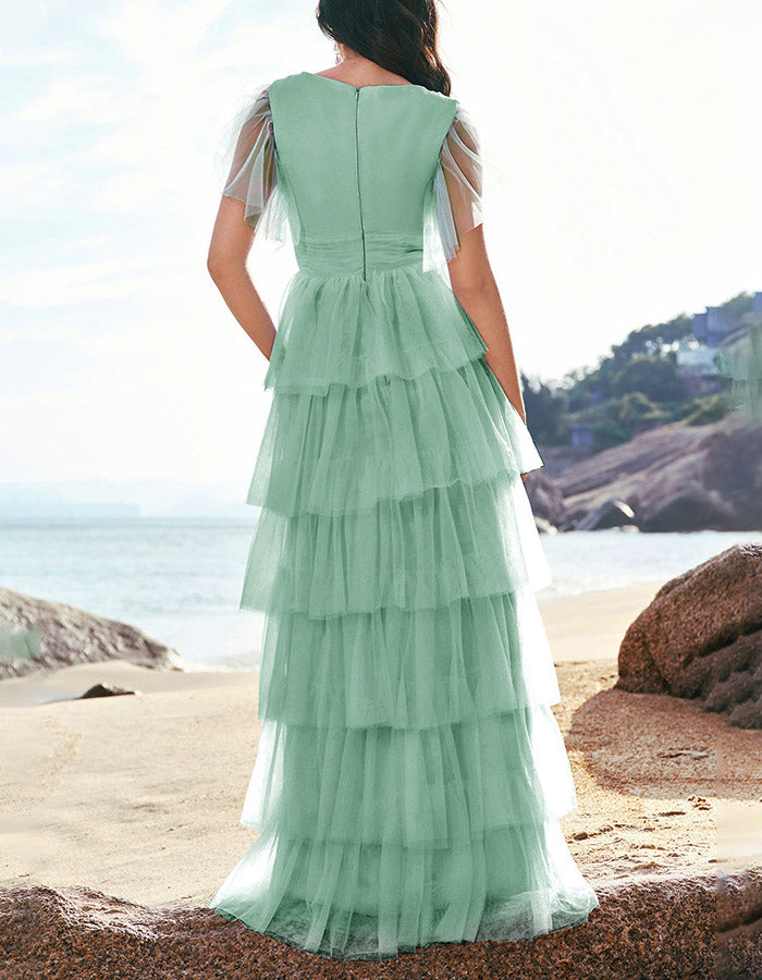 Abito lungo in tulle verde a balze con scollo a V