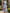 Hellblaues Satin-Midikleid mit Stehkragen und floralem Muster im Tea-Length-Stil