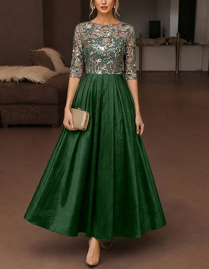 Vestido maxi verde de satén con tul, lentejuelas florales y mangas tres cuartos