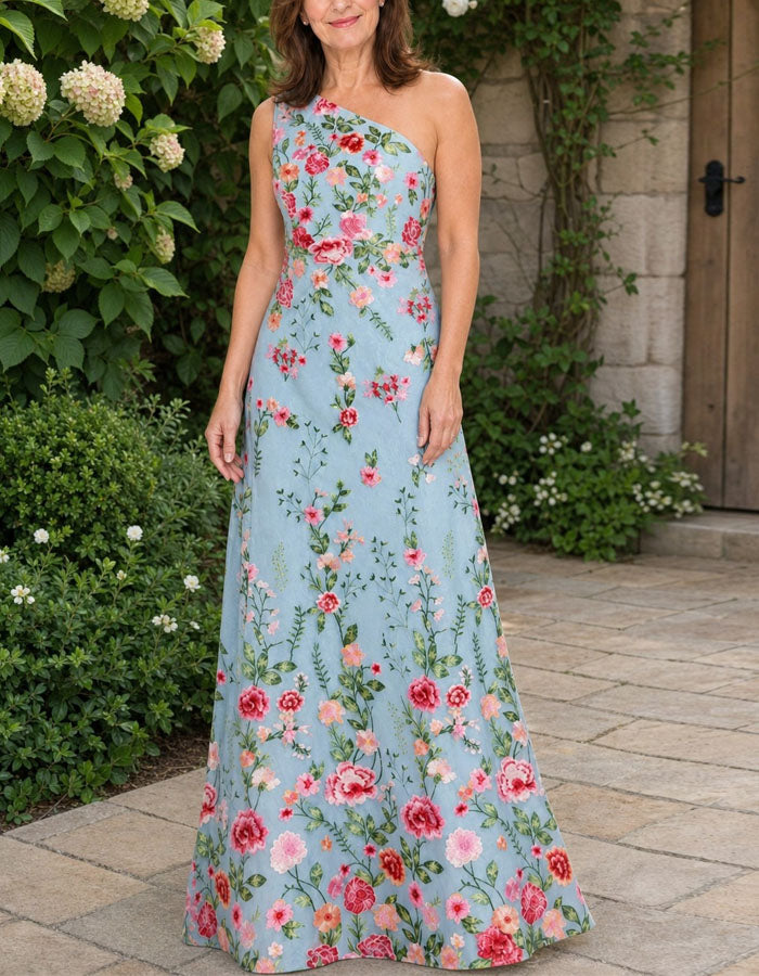 Vestido maxi azul con bordado de malla y bolso en el hombro