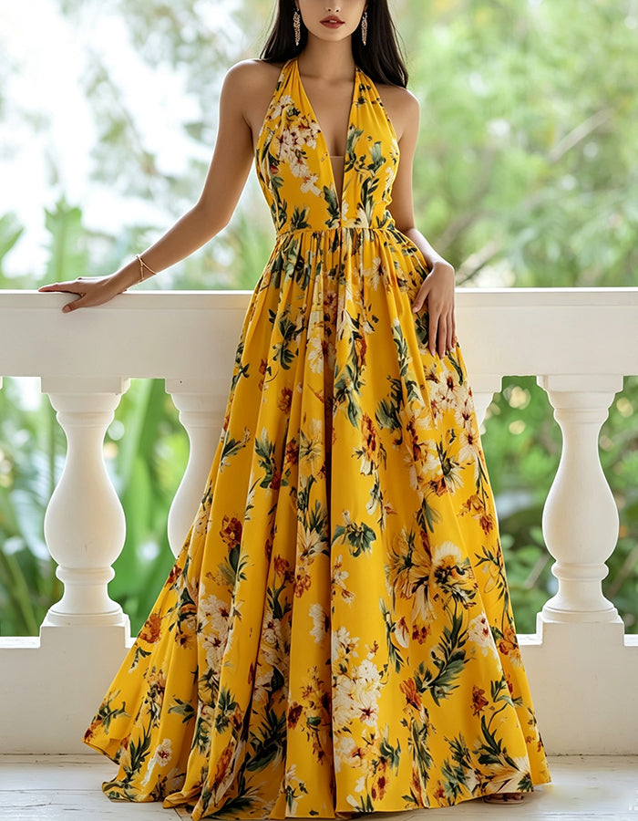 Gele chiffon maxi-jurk met bloemenprint, halterhals, diepe V-hals en empire taille  