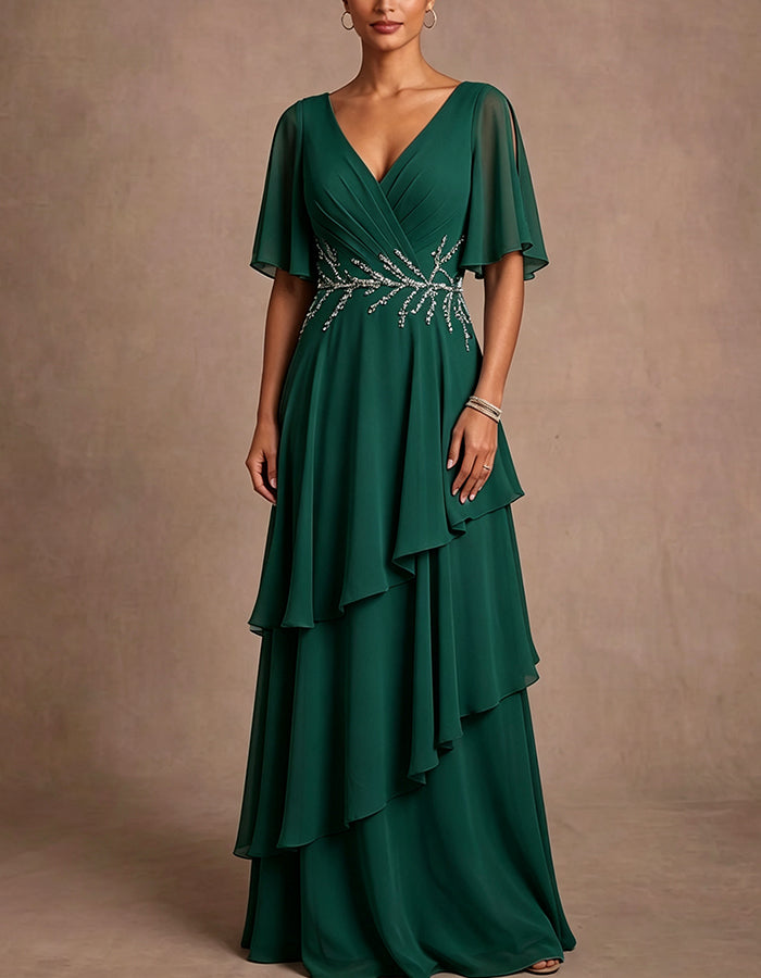 Vestido maxi de gasa azul claro con escote en V profundo, hombros descubiertos, mangas tipo capa y volantes