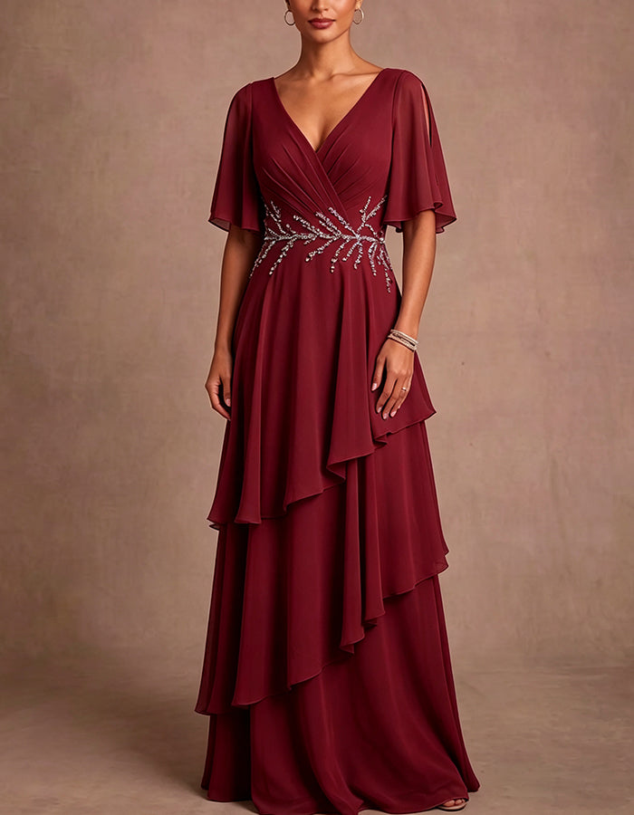 Vestido maxi de gasa azul claro con escote en V profundo, hombros descubiertos, mangas tipo capa y volantes