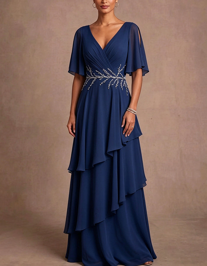 Vestido maxi de gasa azul claro con escote en V profundo, hombros descubiertos, mangas tipo capa y volantes