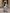 فستان ماكسي أسود وأبيض مكشكش بفتحة صدر عالية وفتحة ساق طويلة وبدون حمالات