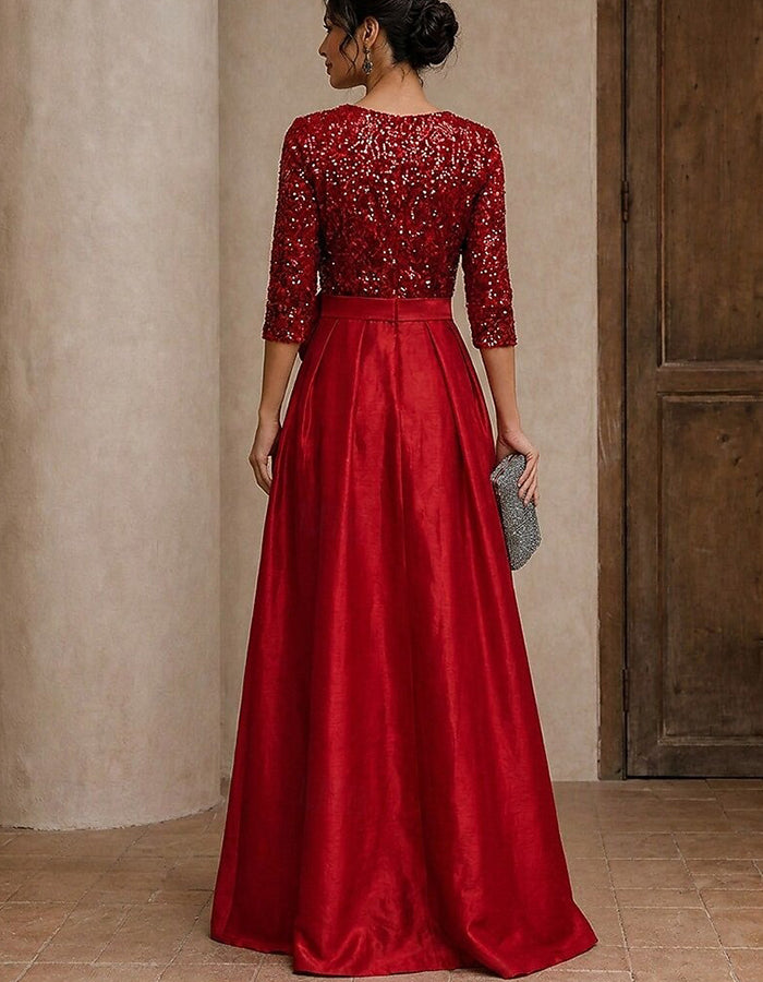 Robe longue satinée trapèze fendue à col en V, manches 3/4 et sequins