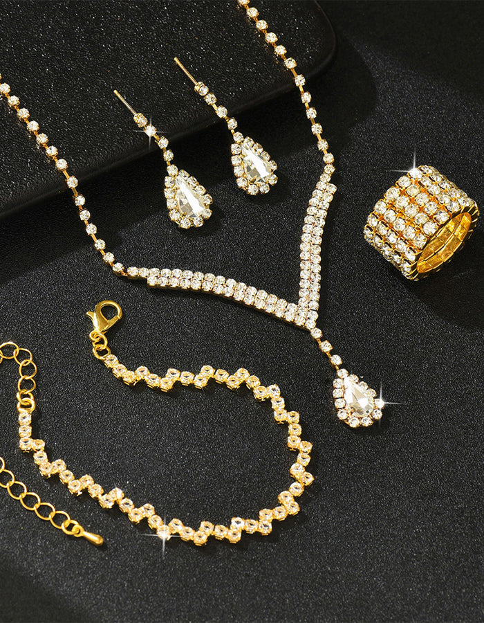 Set da 4 pezzi con collana, orecchini, bracciale e anello a forma di goccia d’acqua