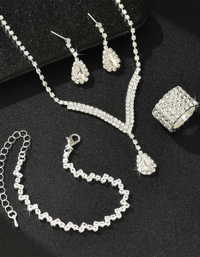 Set da 4 pezzi con collana, orecchini, bracciale e anello a forma di goccia d’acqua