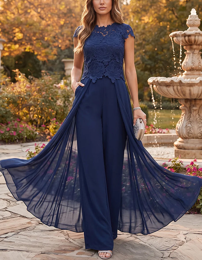 Combinaison-pantalon bleu marine avec dentelle, manches courtes, superposition en mousseline et jambes larges