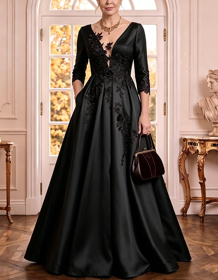Vestido comprido de cetim com decote em V profundo, mangas 3/4, aplicações florais de renda e corte em linha A