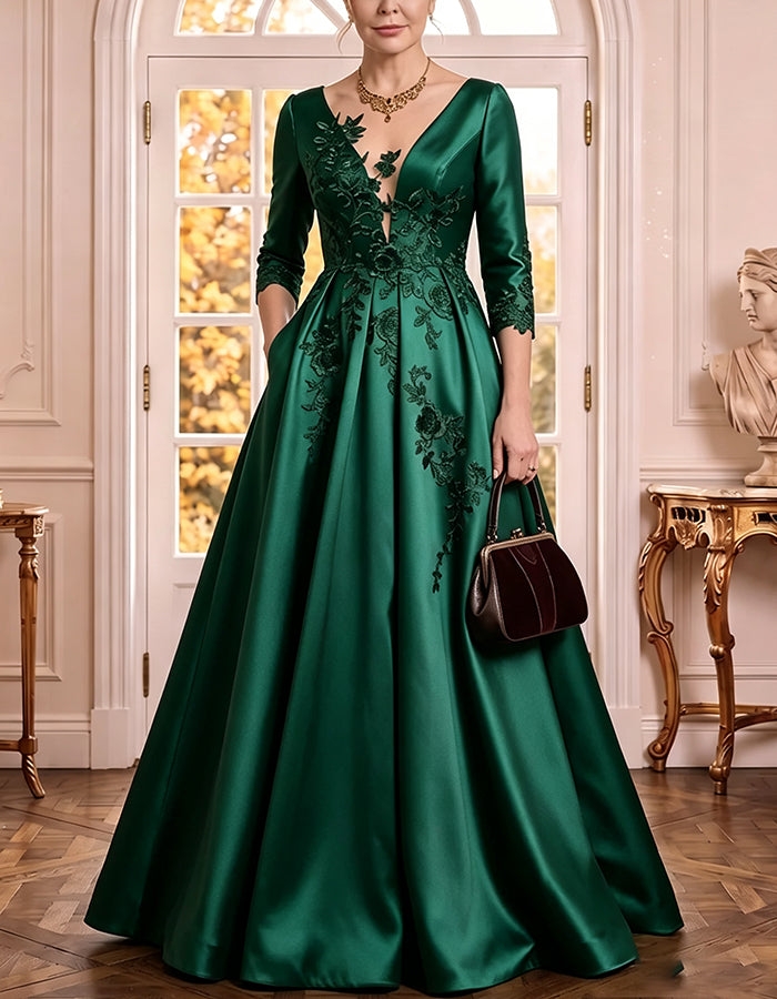 Vestido comprido de cetim com decote em V profundo, mangas 3/4, aplicações florais de renda e corte em linha A