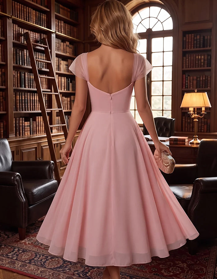 Robe midi trapèze rose en mousseline, à manches courtes et motif floral 3D