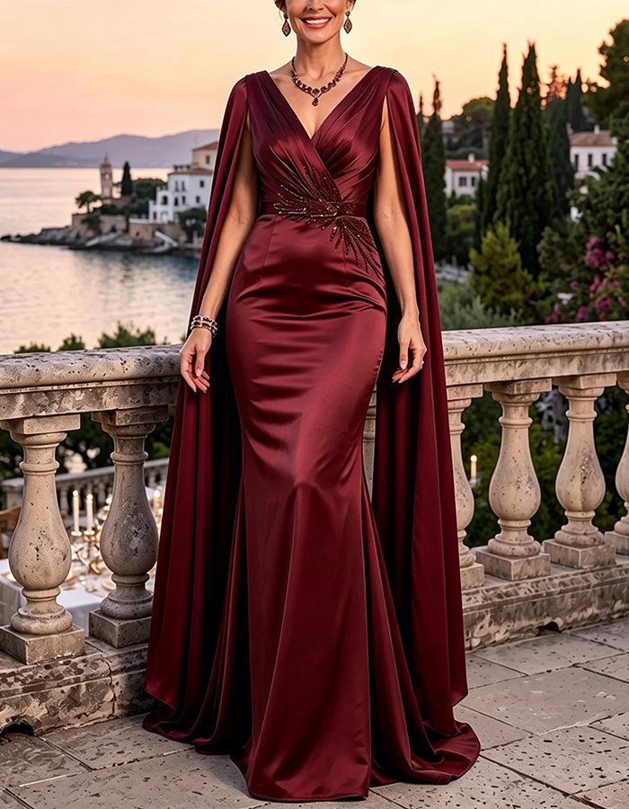 Vestido largo de lentejuelas con escote profundo en V, mangas tipo capa y cintura fruncida