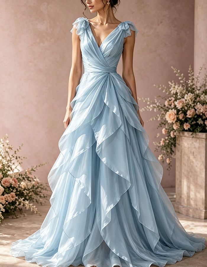 Vestido largo de organza con escote profundo en V, hombros con volantes, lazo y cintura cruzada con torsión