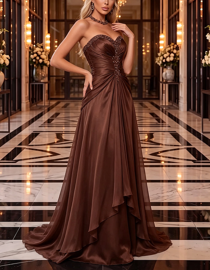 Robe longue marron en mousseline, bustier droit à décolleté cœur, fronces, drapé, volants et coupe trapèze