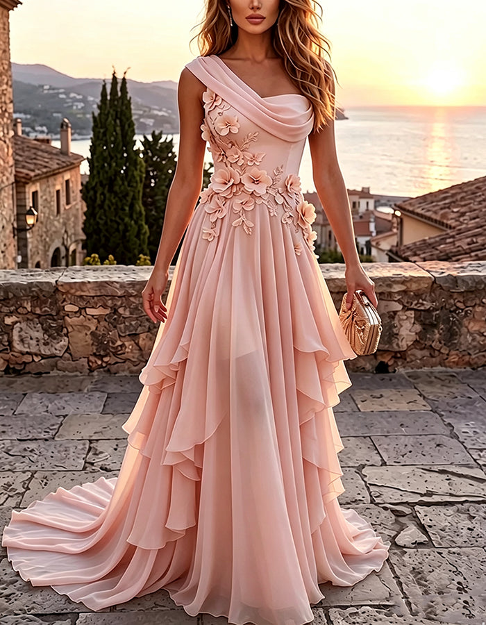 Abito maxi giallo a trapezio in chiffon a balze, con drappeggio monospalla e applicazione floreale 3D