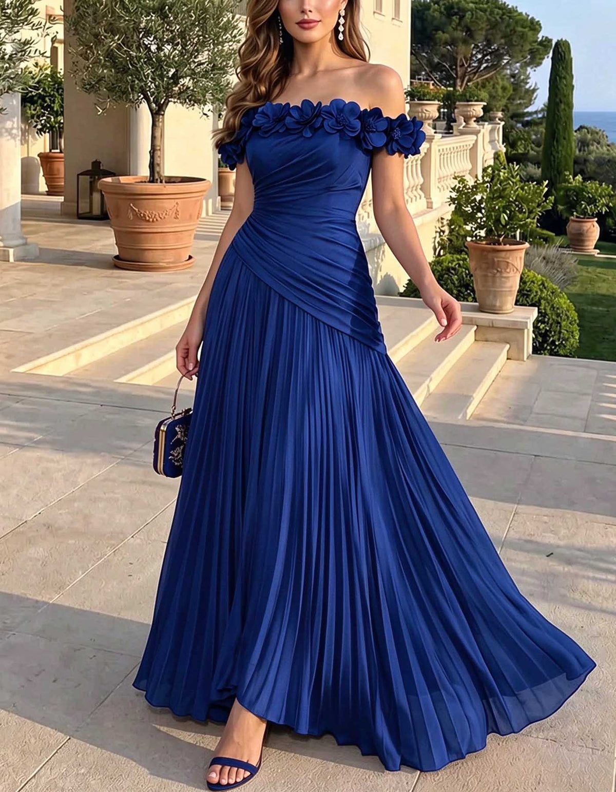 Vestido largo de gasa con hombros descubiertos, flores 3D, plisado y corte evasé