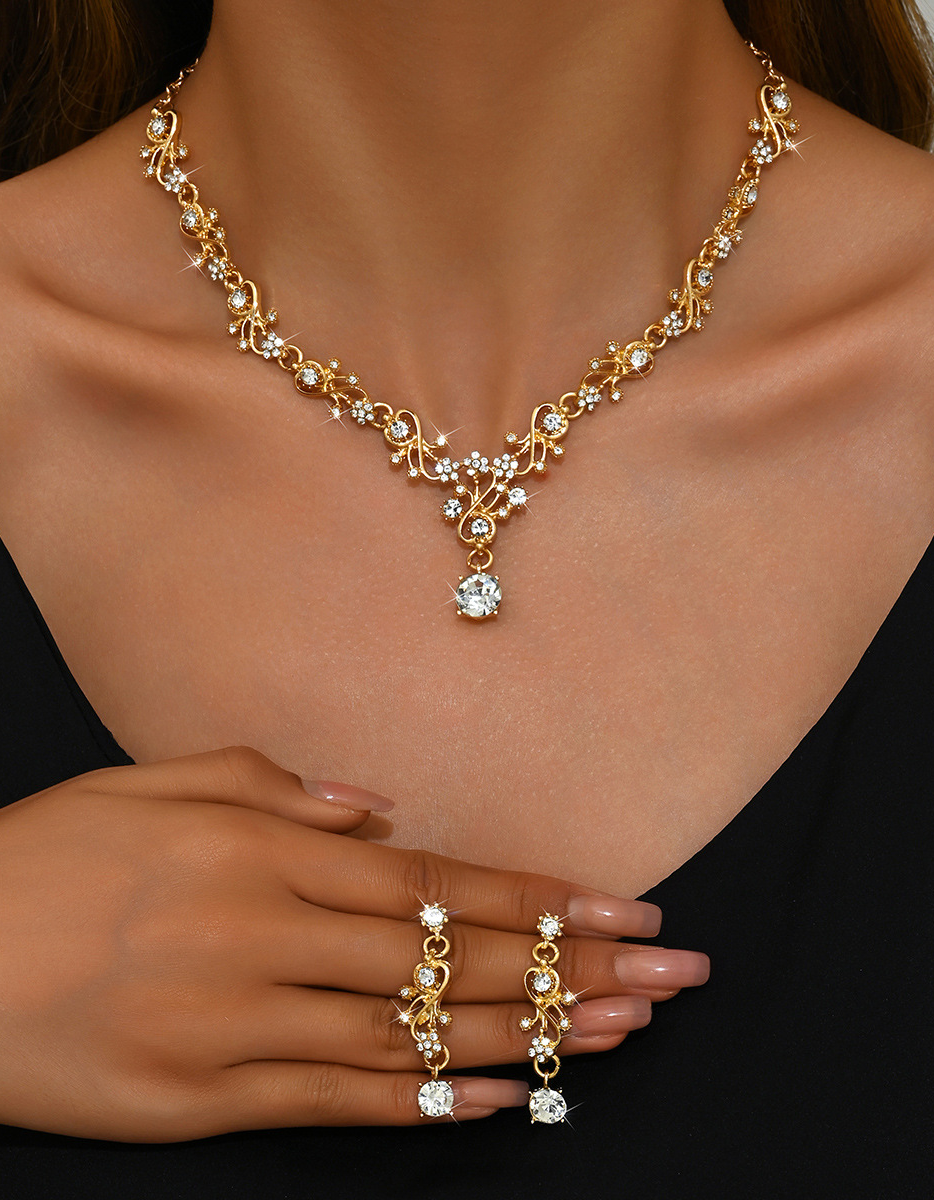 Set di gioielli da donna per feste serali con collana e orecchini a foglia e strass color oro