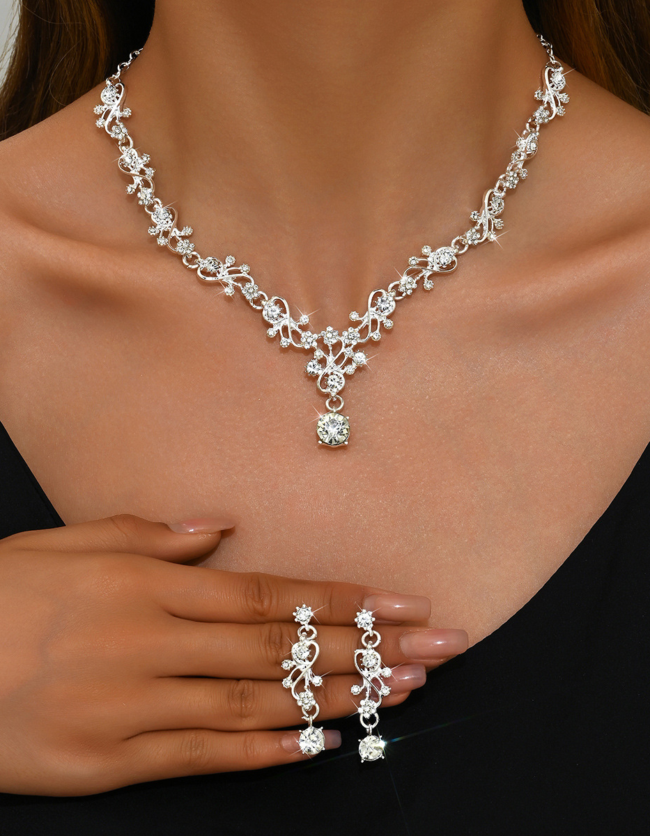 Set di gioielli da donna per feste serali con collana e orecchini a foglia e strass color oro