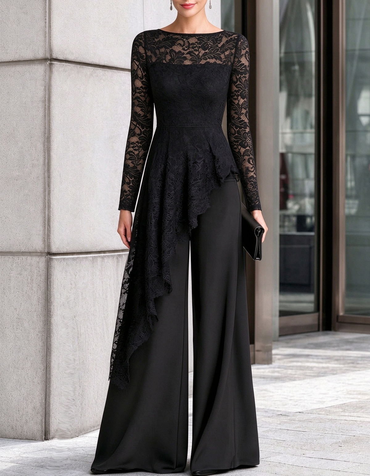 Mono negro de encaje con peplum asimétrico y pernera ancha