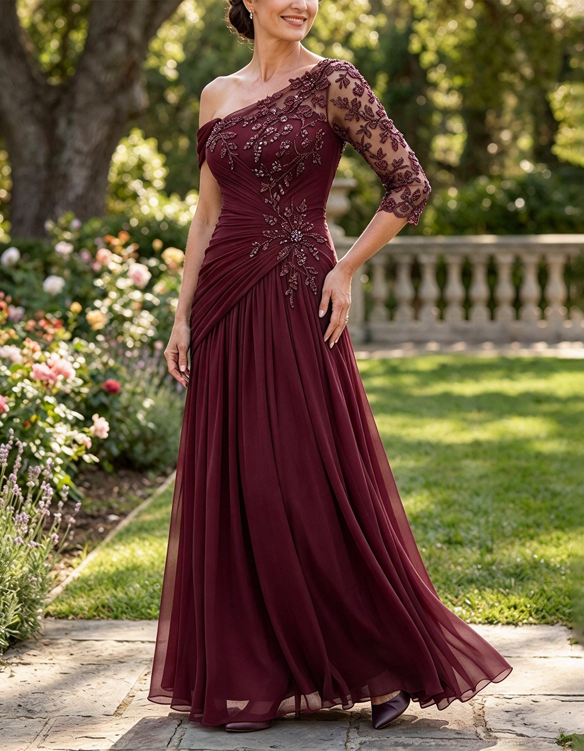 Vestido largo de gasa color verde azulado con un hombro descubierto, efecto ilusión y mangas tres cuartos