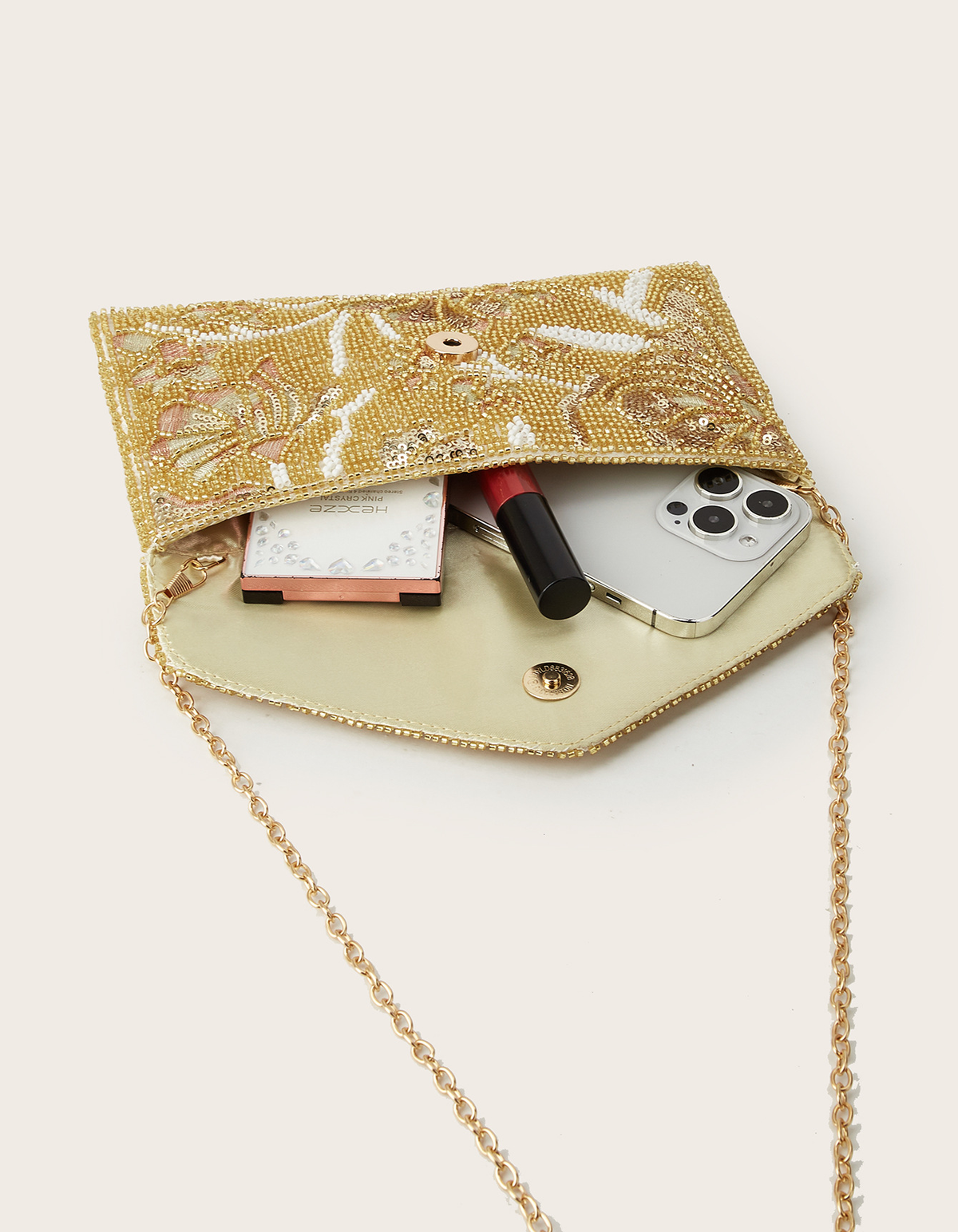 Clutch de noite dourada com contas florais