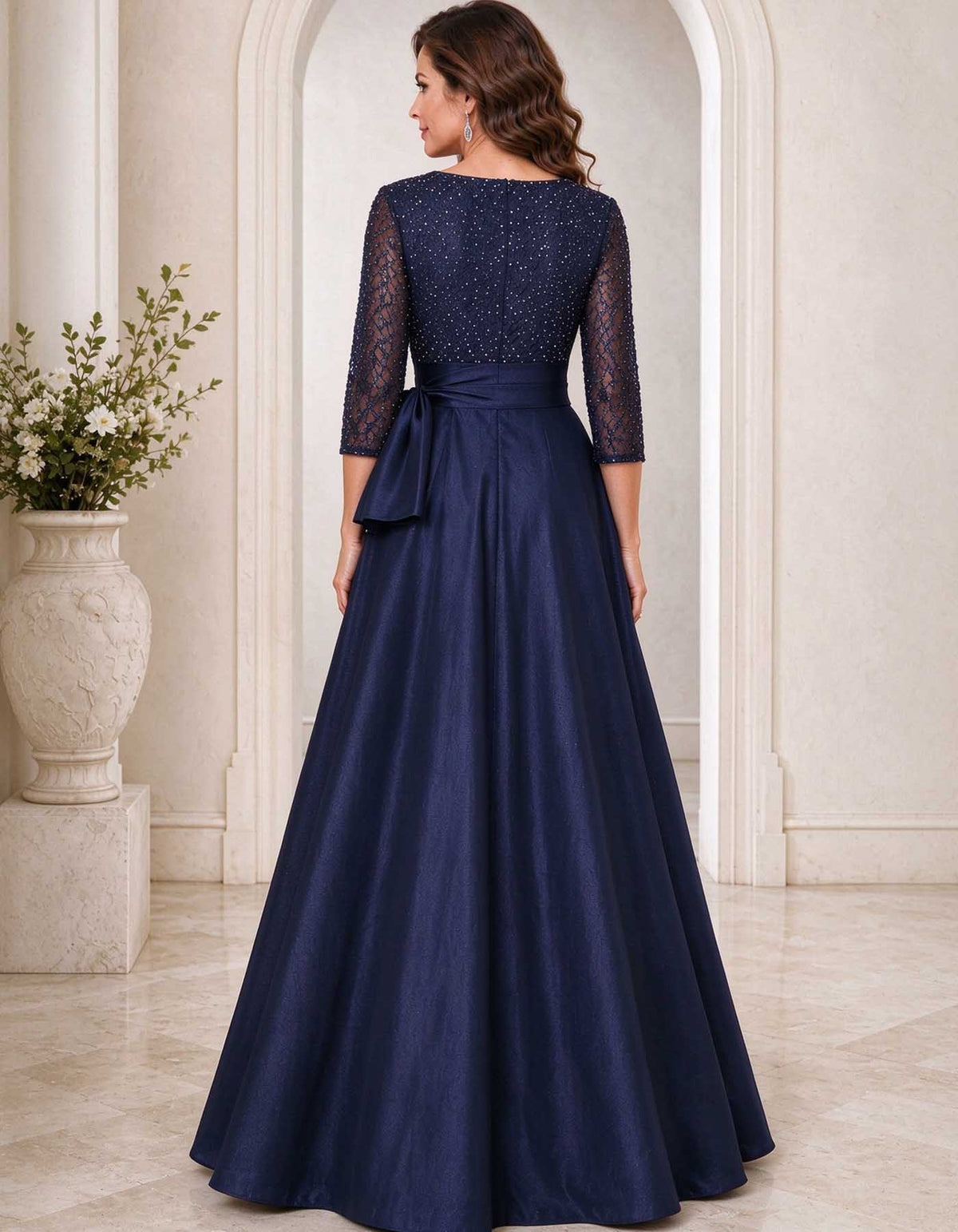Robe longue bleu marine à décolleté en V, corsage à sequins et nœud en satin