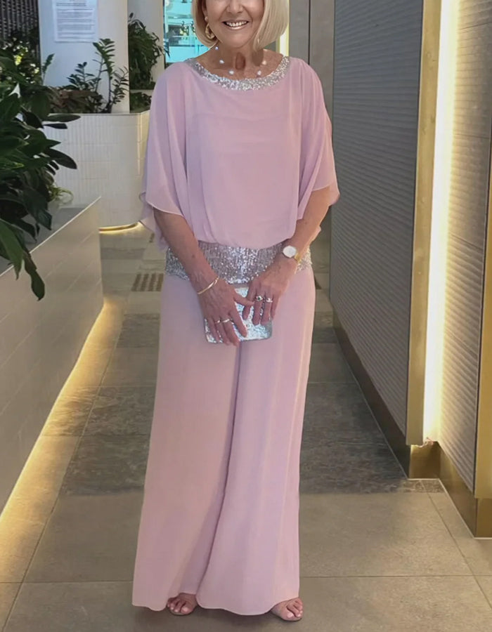 Completo due pezzi rosa con top in chiffon e paillettes e pantaloni
