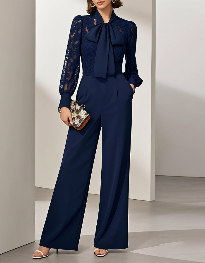 Tuta blu in pizzo con fiocco e maniche lunghe