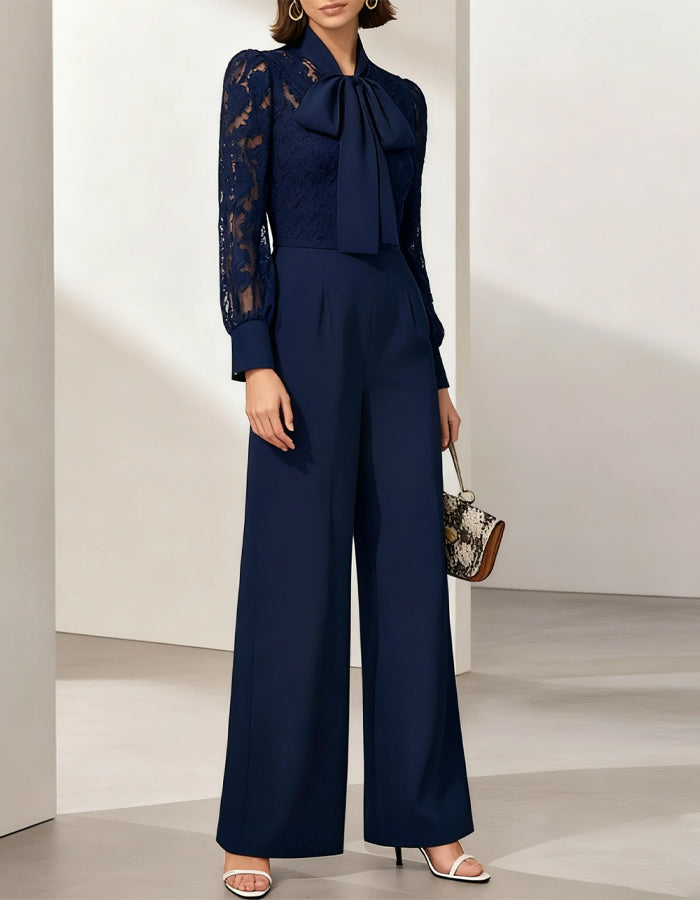 Tuta blu in pizzo con fiocco e maniche lunghe