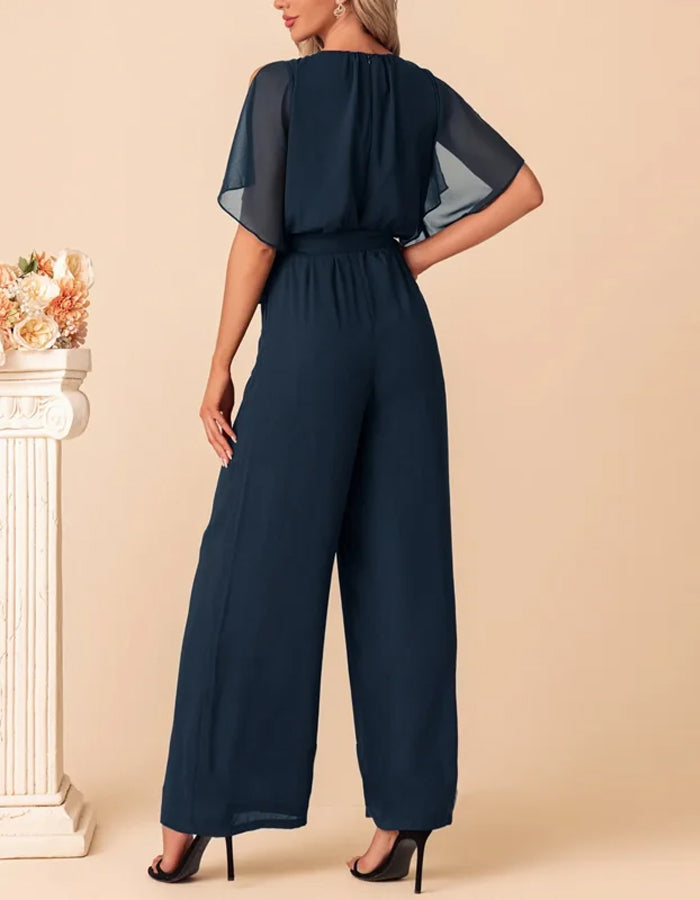 Combinaison en chiffon bleu marine avec manches fluides et ceinture à la taille
