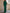 Groene jumpsuit met blote schouders en uitlopende pijpen