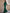 Groene jumpsuit met blote schouders en uitlopende pijpen