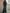 Groene jumpsuit met blote schouders en uitlopende pijpen