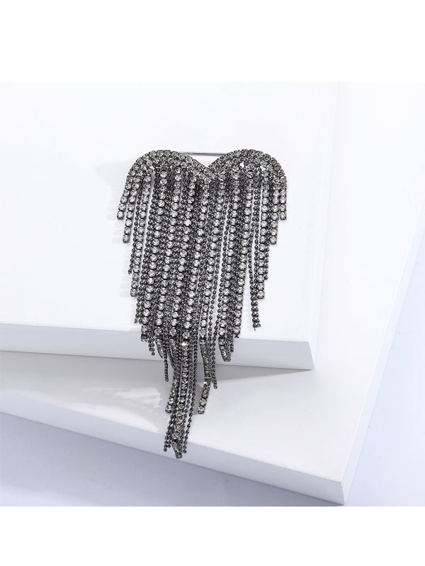 Broche de corazón con borlas