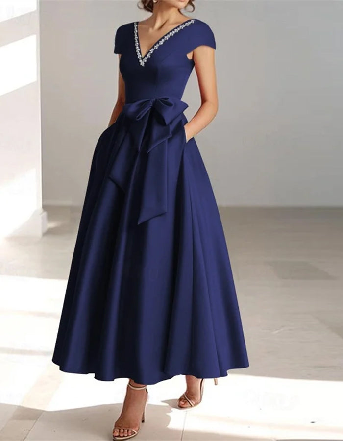 Vestido midi con mangas cortas, gran lazo y escote en V en color sólido