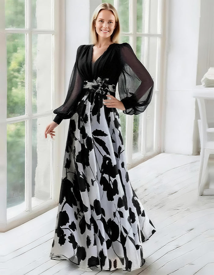 Robe élégante en chiffon bleu marine avec jupe à imprimé floral et manches évêque transparentes