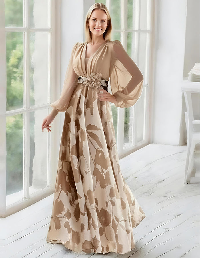Elegante vestido de noche de gasa azul marino con falda estampada floral y mangas obispo transparentes