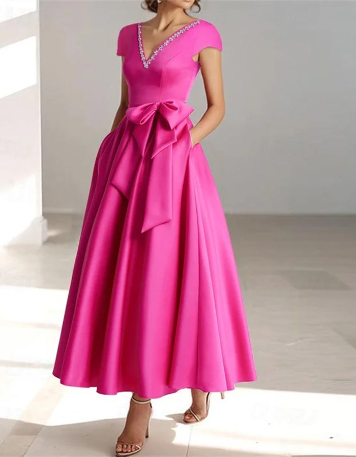 Vestido midi con mangas cortas, gran lazo y escote en V en color sólido