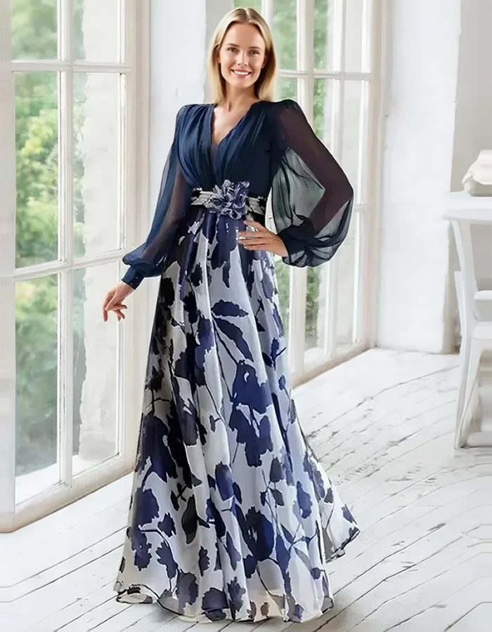 Elegantes marineblaues Chiffonkleid mit floralem Rock und transparenten Bischofärmeln